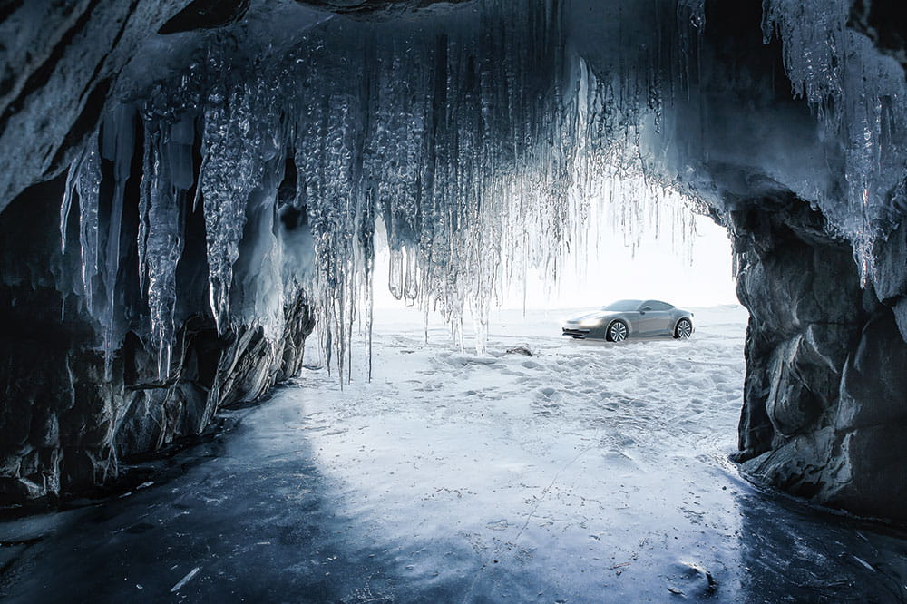 View from an ice cave and there is a car in front of the ice cave
