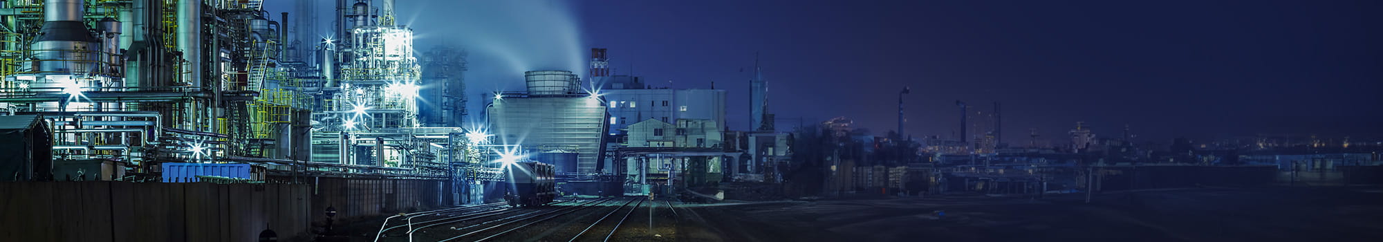 Large factory area for fluids with railroad tracks and train transportation