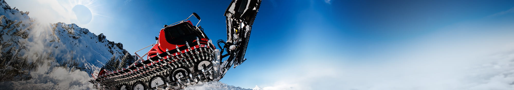 Snow plow machine photographed from the side and in the snow