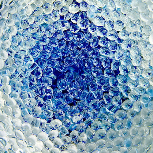 The appearance of elastomer material corresponds to white and blue bubbles