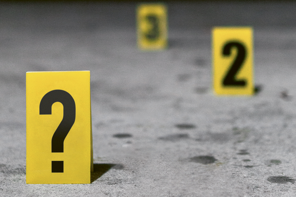 Yellow evidence cards on the ground