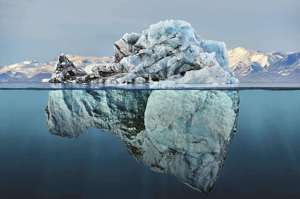Image of an iceberg above and below sea level. Copyright: posteriori/ istockphoto.com