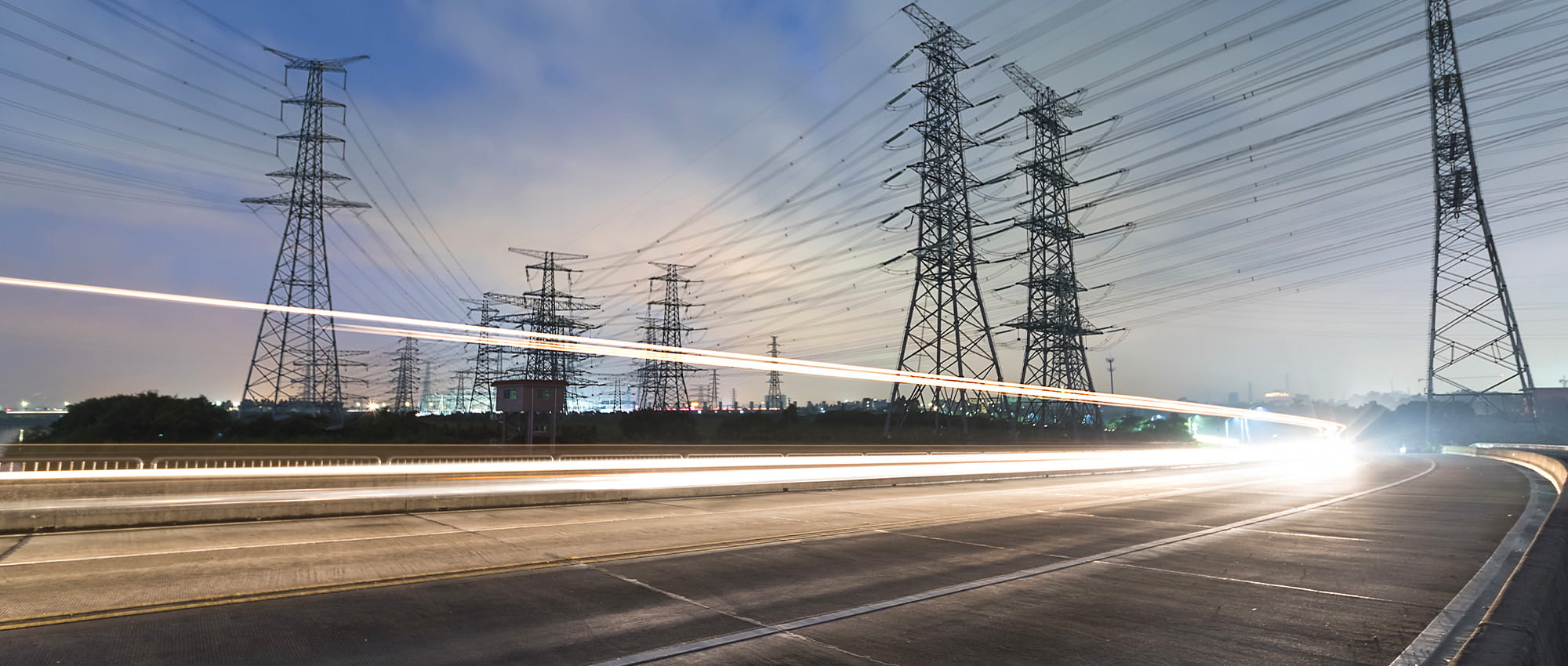 A street at night with power poles around