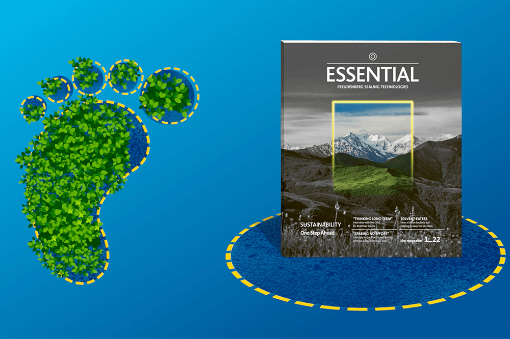 On the left is an illustration of plants in the form of a footprint and to the right is Essential magazine against a blue background.