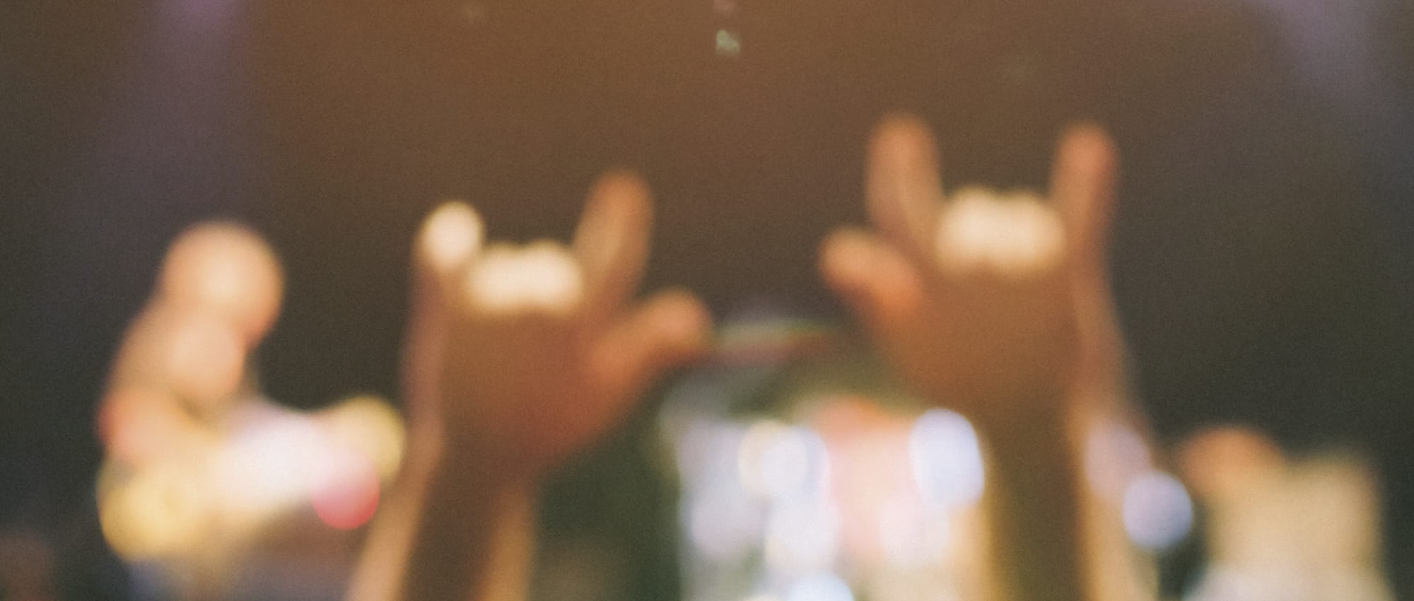 Hands in the air at a concert. Copyright: iStock: MoreISO