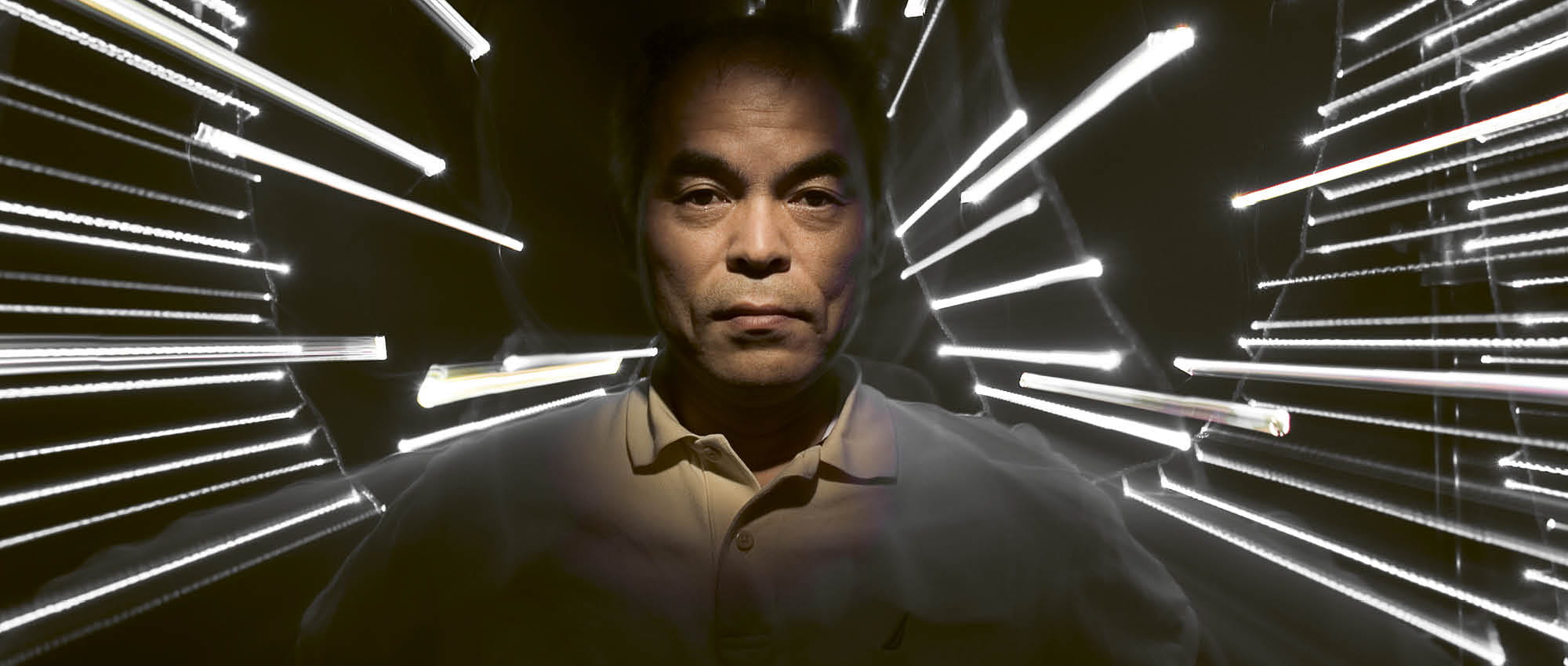 Portrait of Dr. Nakumara with a black background and lightbeams. Copyright: David Strick; Redux; laif