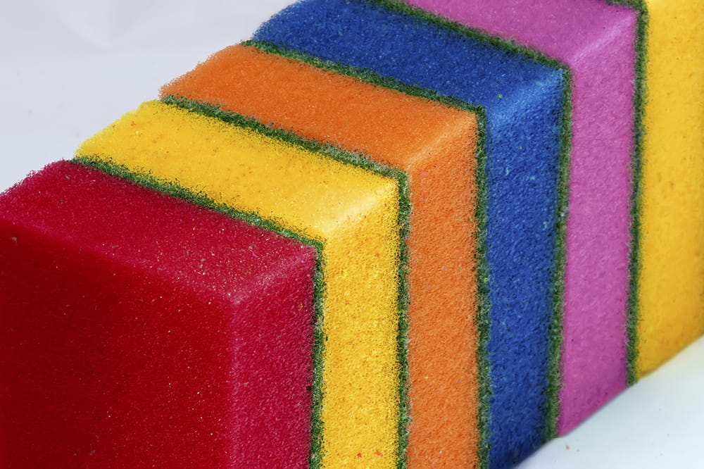 Colorful sponges lined up in a row.