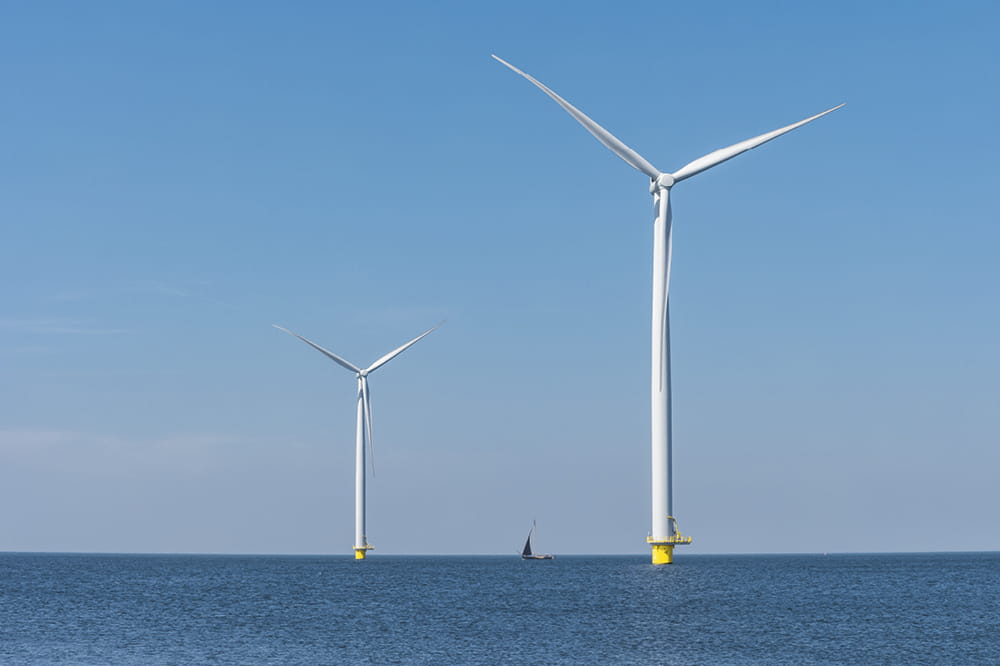 Wind turbines stand in the sea. Copyright: Shutterstock: Fokke Baarssen