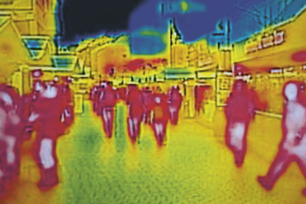 Thermal image of passers-by on a street. Copyright: iStock/ivansmuk