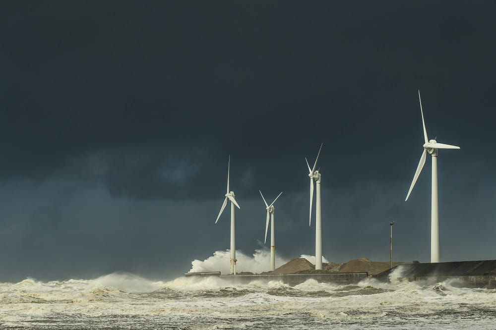 Wind turbines in stormy weather.
