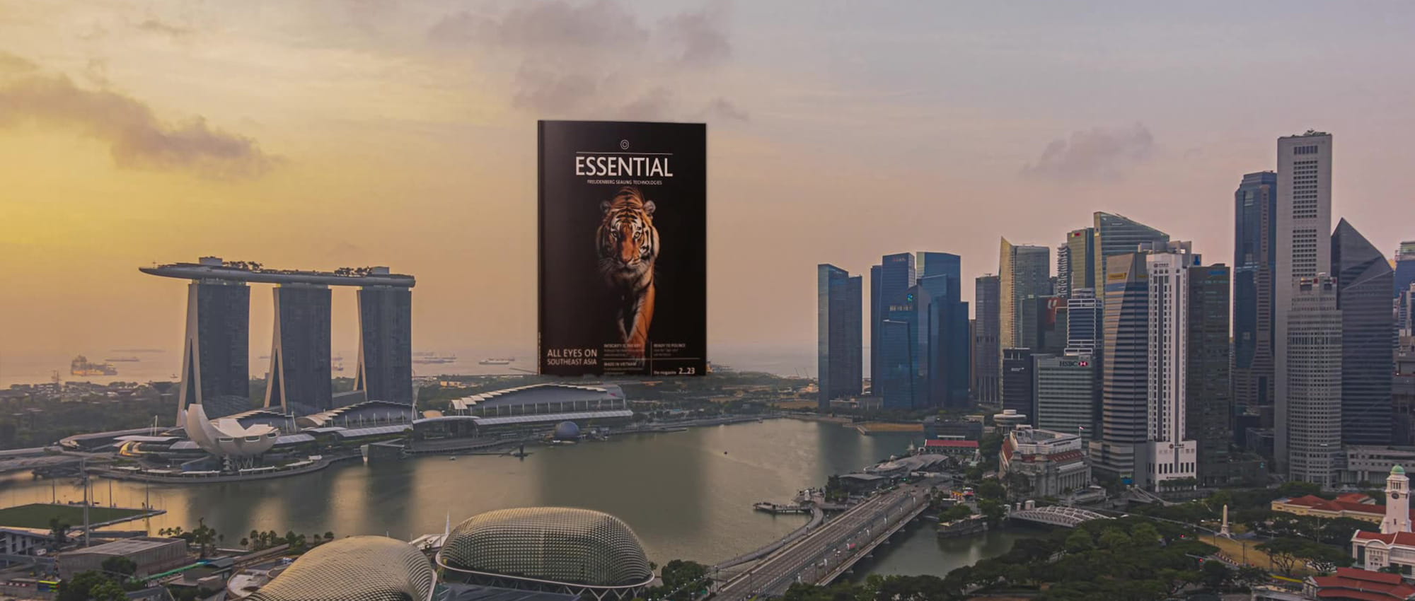 Skyline of Singapore with ESSENTIAL magazine on the horizon