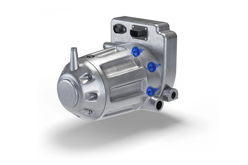 Metal component with cylindrical and rectangular parts, four blue plastic elements on the side.