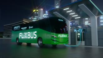 Computer-generated image of a fuel cell bus at a hydrogen refueling station at night