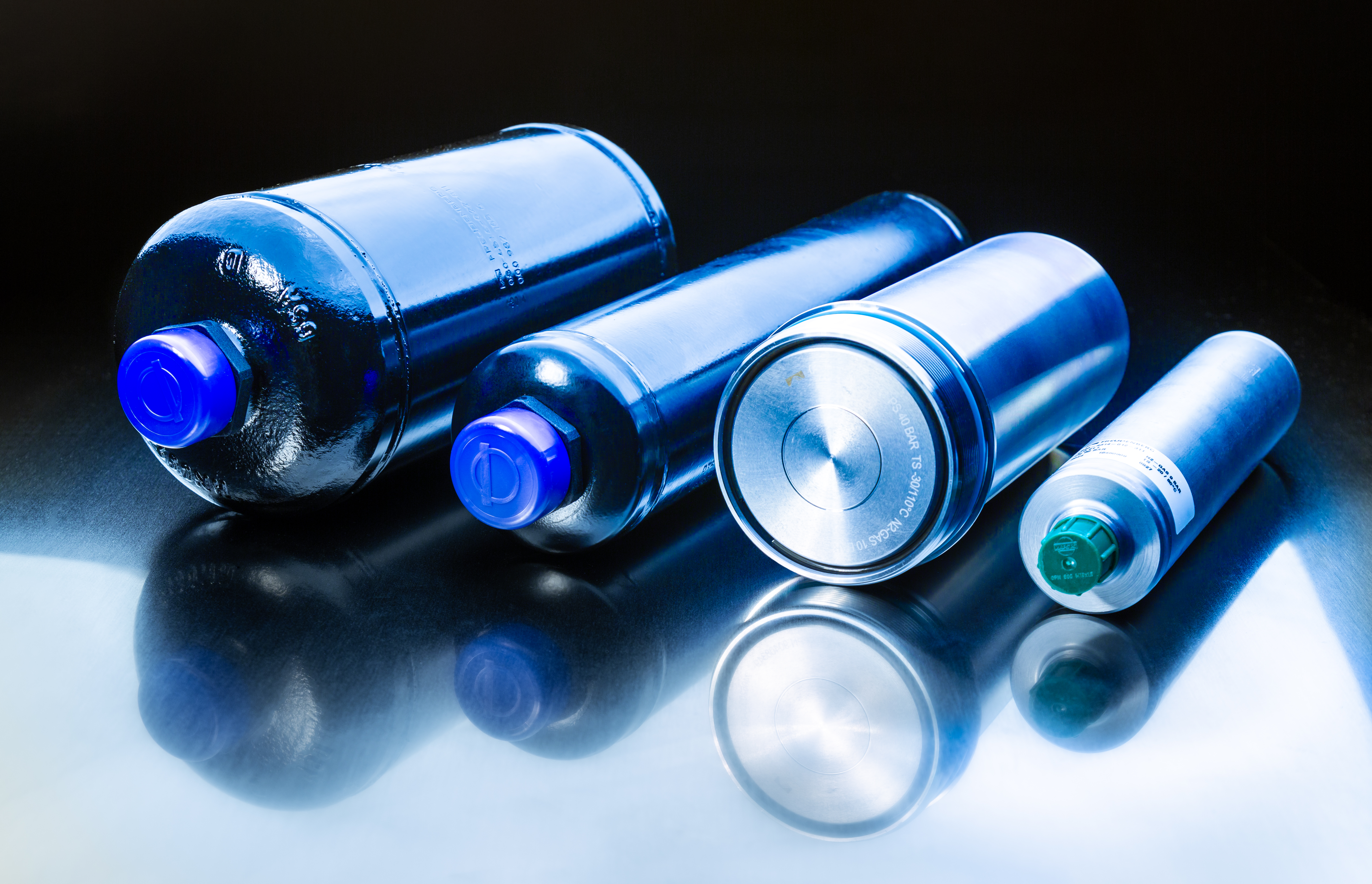 Piston hydraulic accumulators for automotive and agricultural applications