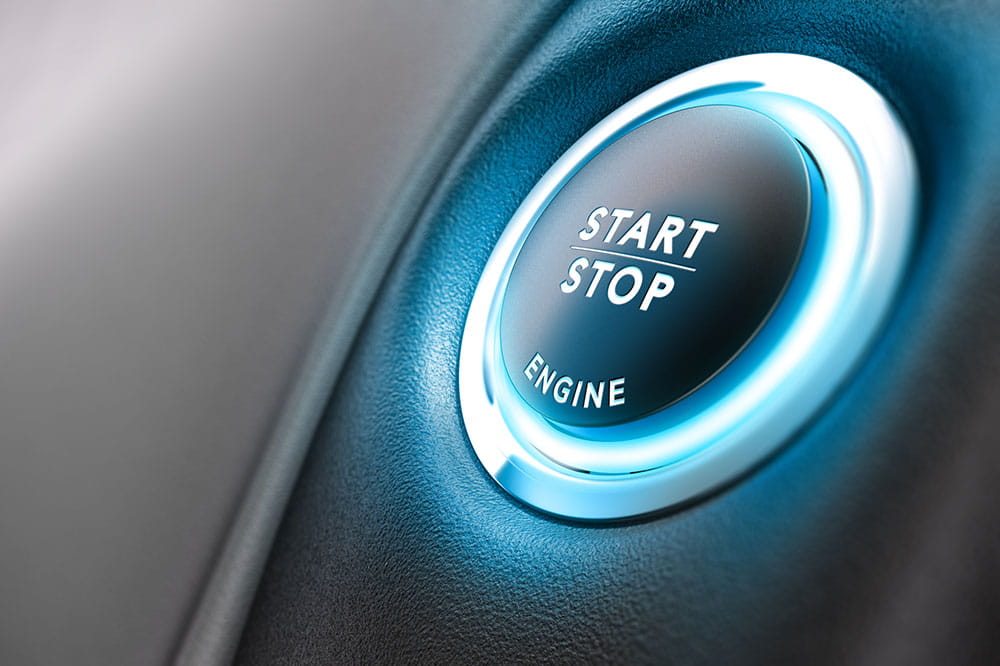 Blue button to start and stop an engine