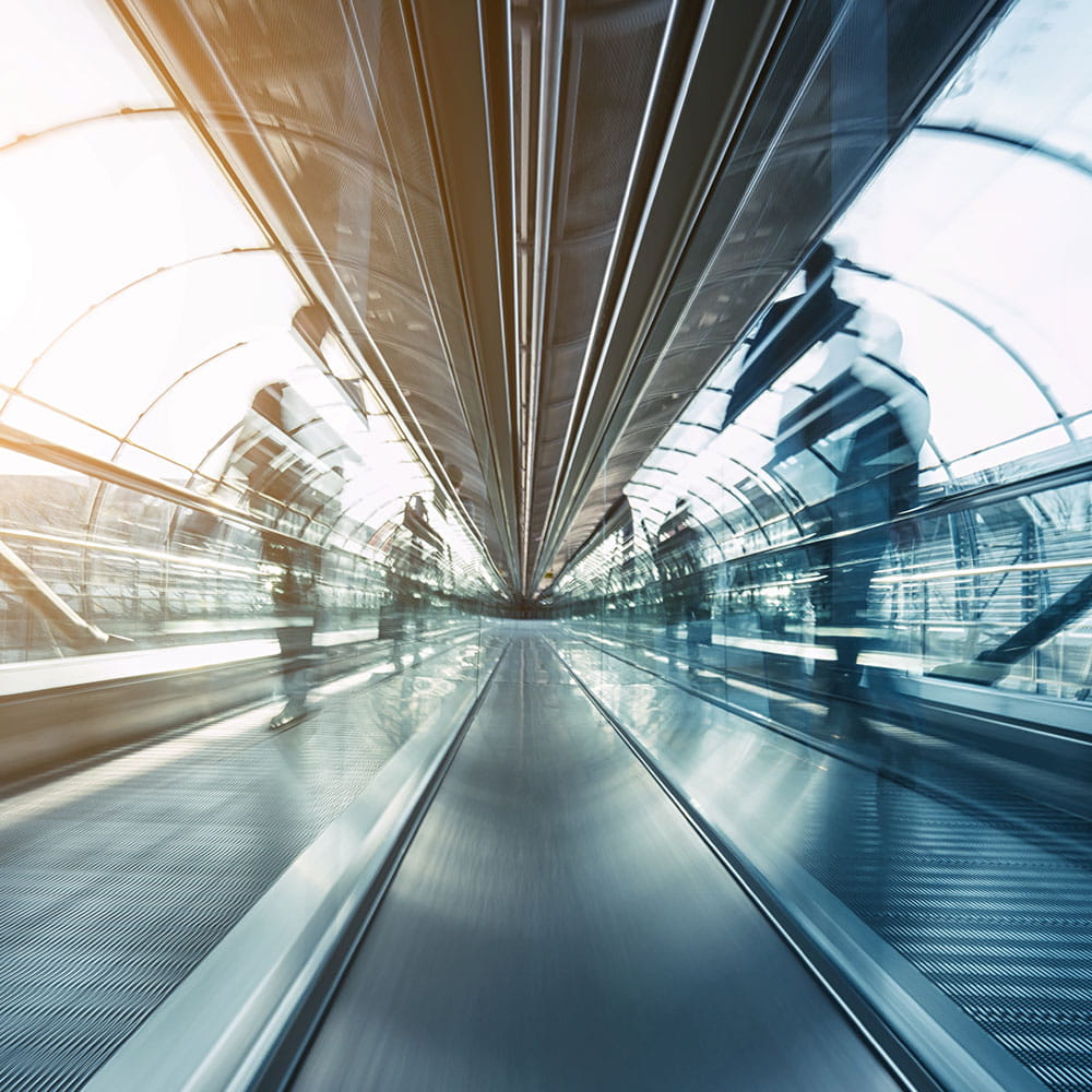 blurred business passengers on a walkway