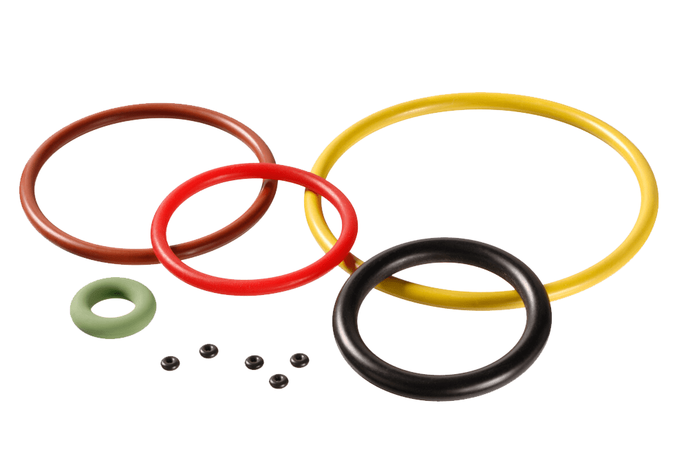 A variety of colorful large and small Simmerrings lie on a white background