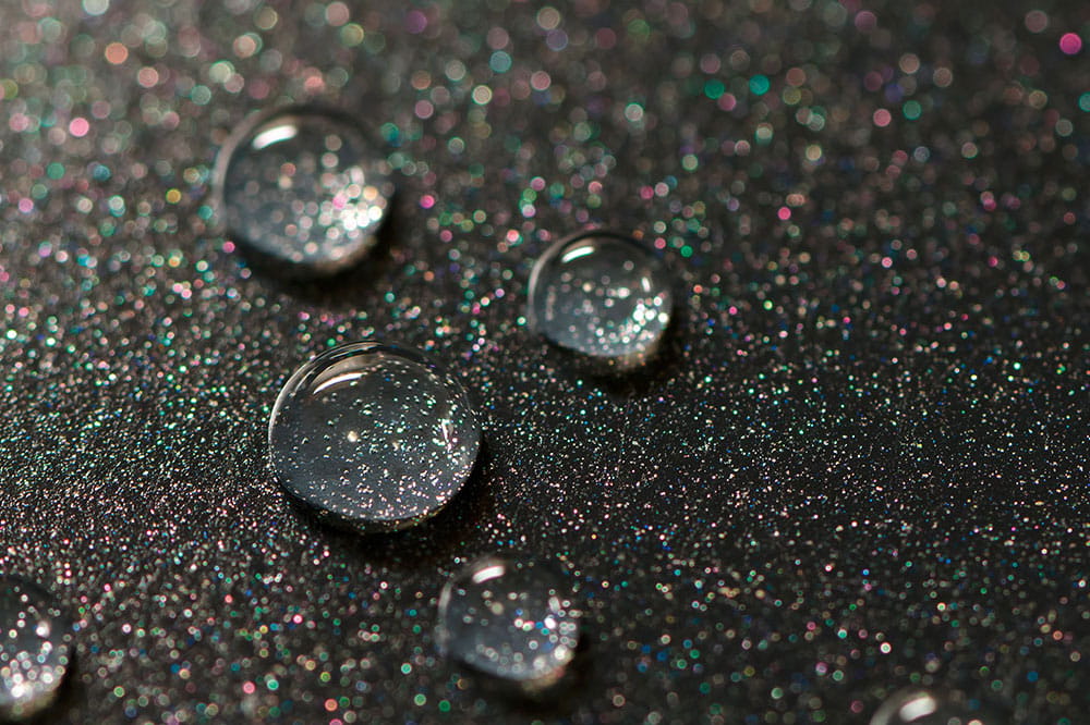 Close-up of a non-stick surface with beading drops