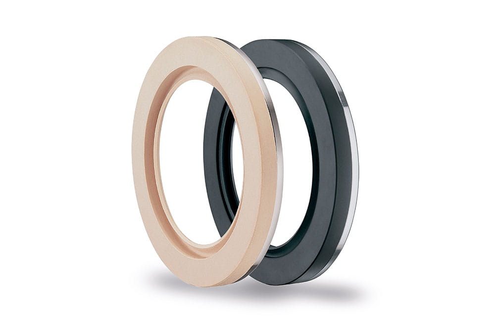 Composing of two radial shaft seals in beige and black with integrated metal part.