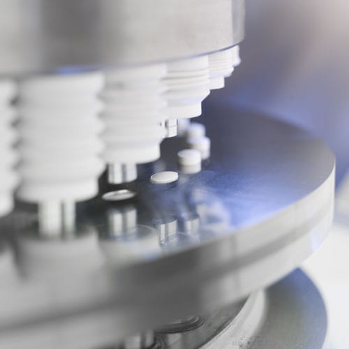 Close up of pharmaceutical machine during process of synthesis of medicines