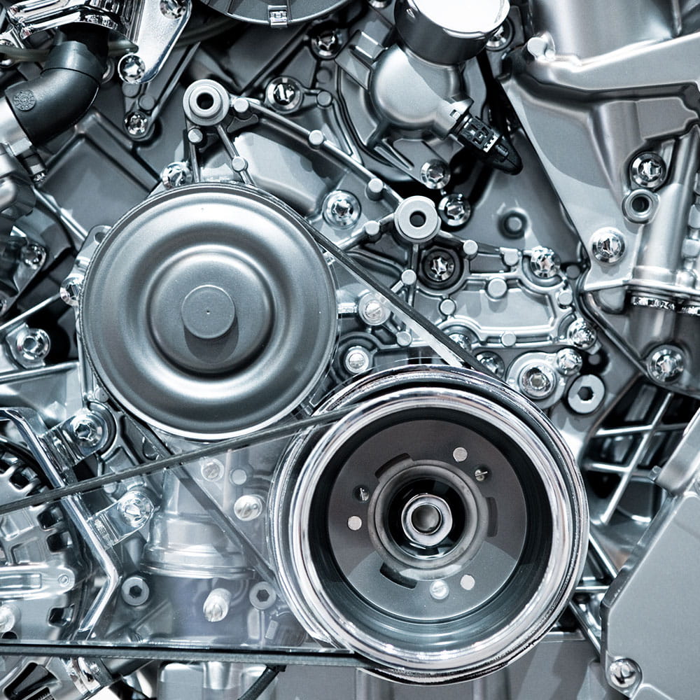 Close up of silver combustion engine of vehicle