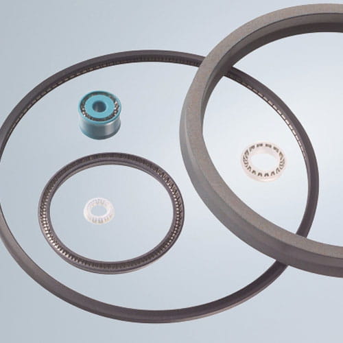 Forseal from Freudenberg Sealing Technologies in various sizes and designs on a gray background