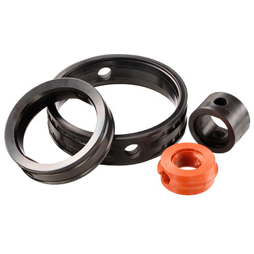 Flap Seals in various sizes and colors from Freudenberg Sealing Technologies on a white background