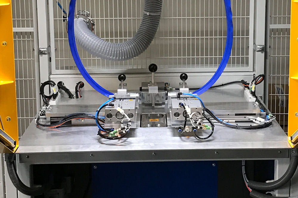 Blue gasket is welded on a metallic surface by a machine 