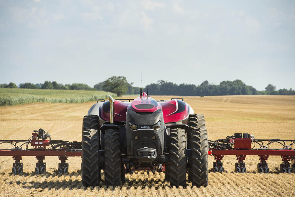 Case IH Case New Holland autonomous tractor on the field with plow 