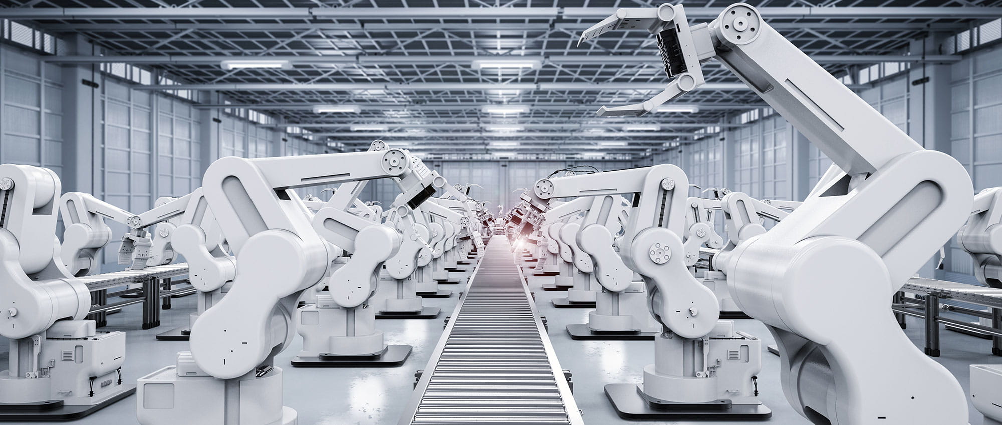 Many white robots along a production line